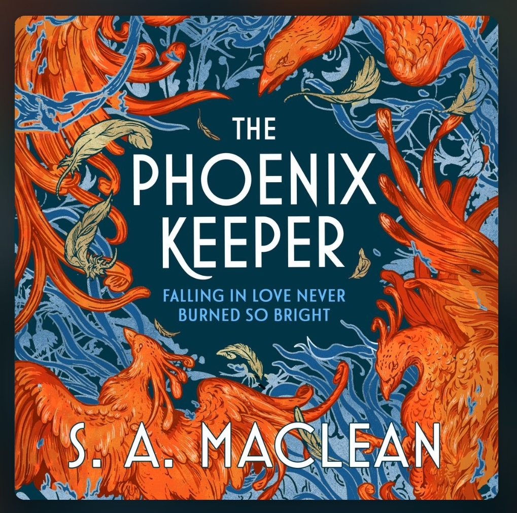 screenshot of Phoenix Keeper book cover: the title written in white is centered, surrounded by red phoenixes, blue leaves, and gold feathers