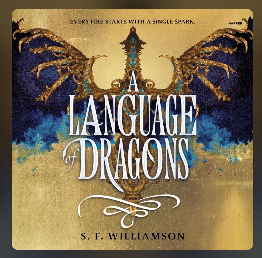 screenshot of A Language of Dragons cover: a golden background, with a dragon in the center. Its wings are dark blue, and its body is metallic gold, reminiscent of a gilded decoration. The title is overlaid on the dragon in white text.