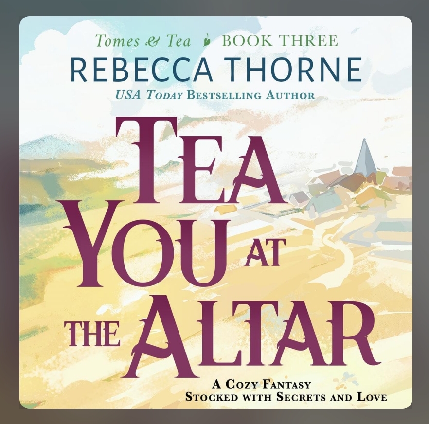 screenshot of Tea You at the Altar: pastel yellows are the background, with a small quaint country town in the background. The title is in maroon, taking up most of the cover.